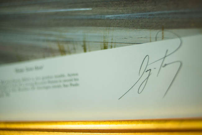 Three select framed artworks of a motoring nature-Auction Lot