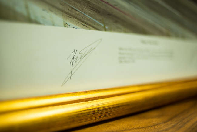 Three select framed artworks of a motoring nature-Auction Lot