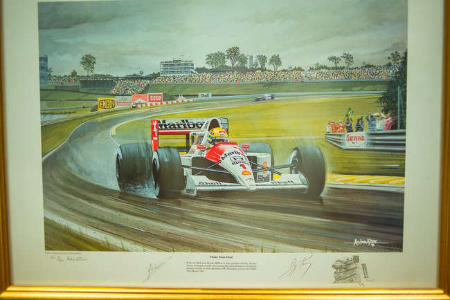 Three select framed artworks of a motoring nature-Auction Lot