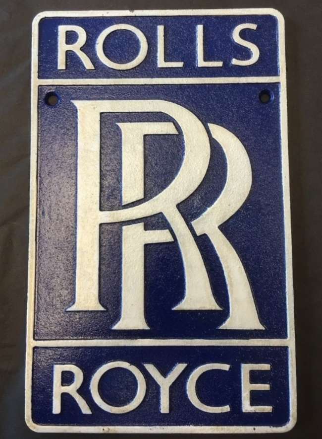 Period-style cast metal Rolls-Royce wall plaque.-Sold