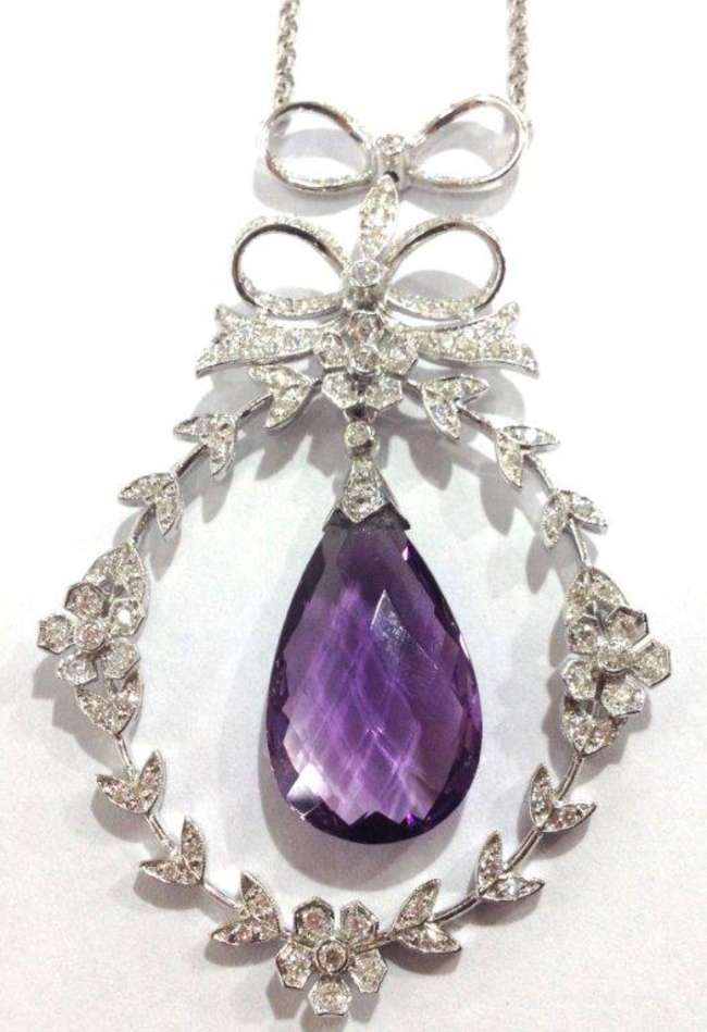 An 18ct white gold and diamond encrusted necklace with centr-Auction Lot