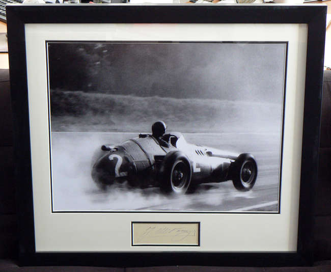  Juan Manuel Fangio, signed presentation.-Sold