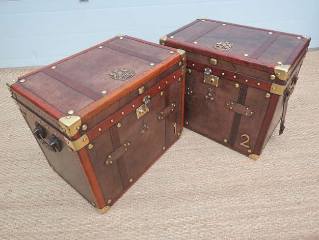 A pair of Army and Navy leather travel trunks-Sold