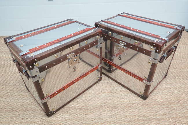 A pair of aluminium covered travel trunks-Sold