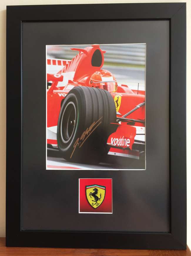 Michael Schumacher signed photograph.-Sold