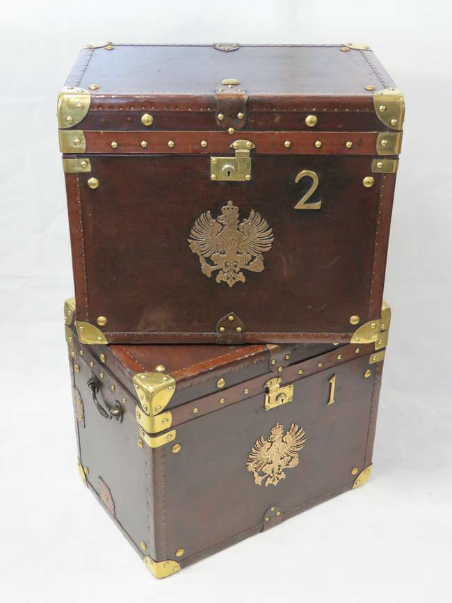 Pair of Army and Navy leather & brass Covered Travel Trunks-Auction Lot