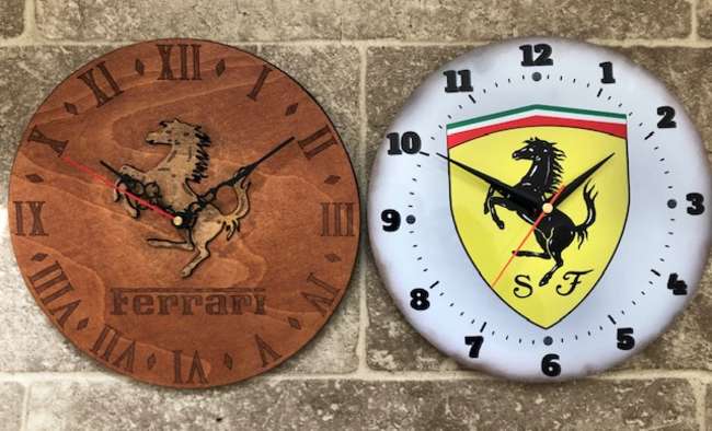 Two Ferrari themed wall clocks-Sold