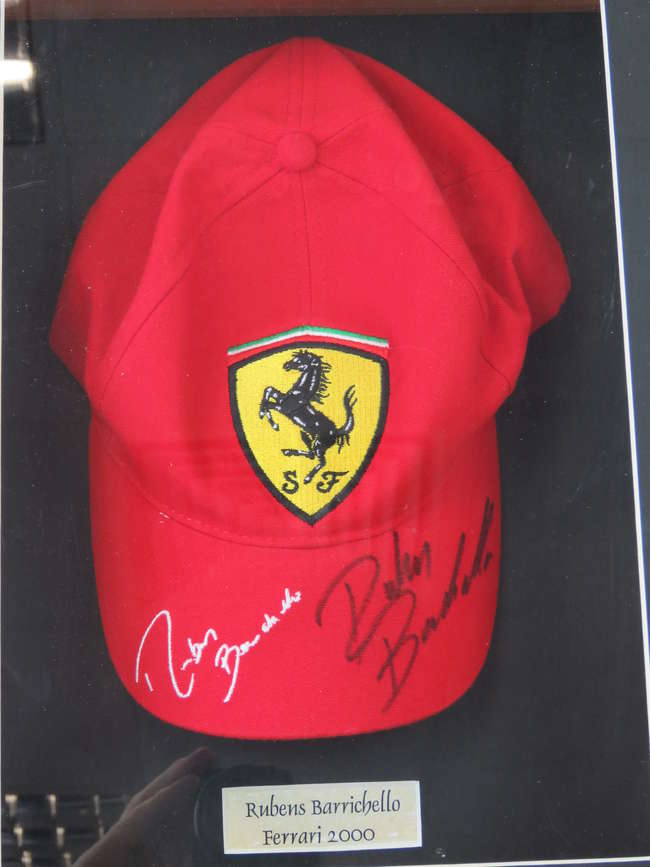 A Rubens Barrichello signed Ferrari cap.-Sold