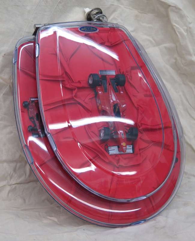 A Ferrari themed toilet seat-Auction Lot