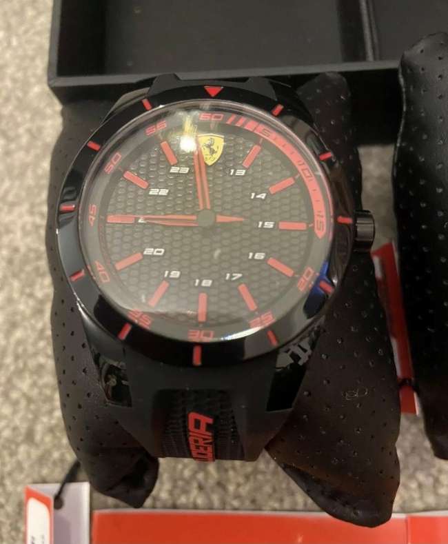 A rare boxed pair of 'His & Hers' Scuderia Ferrari Sports wa-Sold