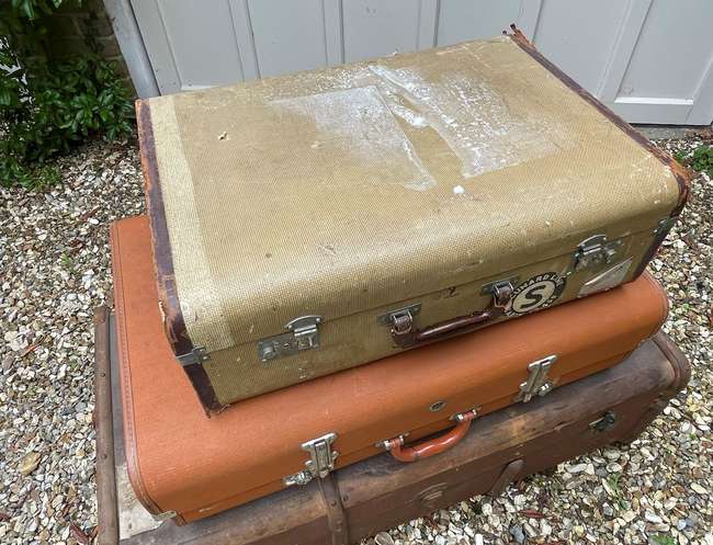 Selection of Four Well-Travelled Suitcases-Auction Lot
