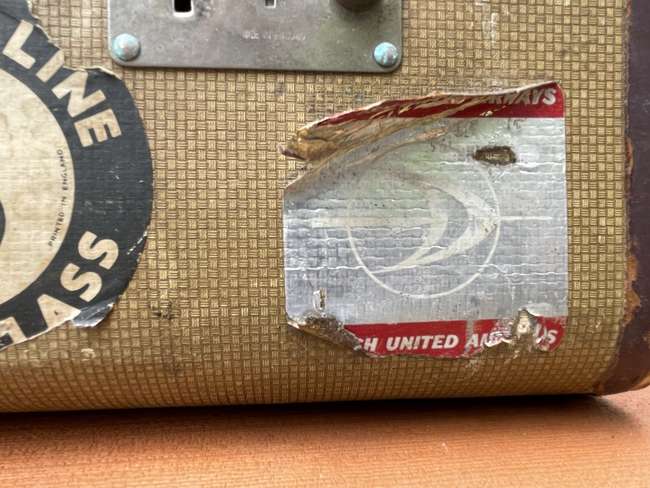 Selection of Four Well-Travelled Suitcases-Auction Lot