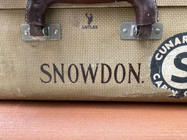 Selection of Four Well-Travelled Suitcases-Auction Lot