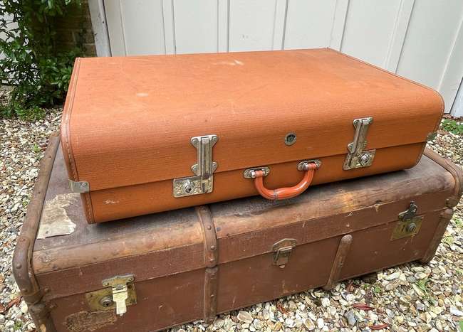 Selection of Four Well-Travelled Suitcases-Auction Lot