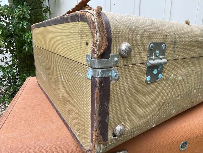 Selection of Four Well-Travelled Suitcases-Auction Lot