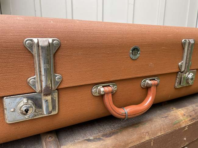 Selection of Four Well-Travelled Suitcases-Auction Lot