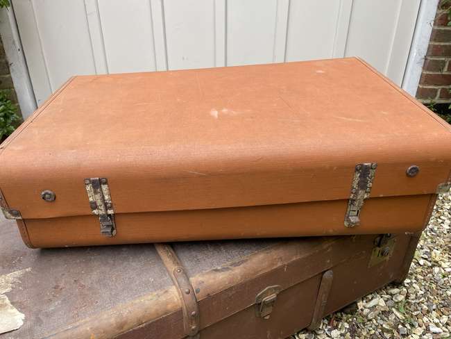 Selection of Four Well-Travelled Suitcases-Auction Lot