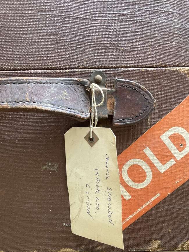 Selection of Four Well-Travelled Suitcases-Auction Lot