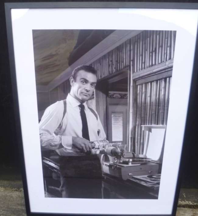 A Pair of Framed Prints depicting Sean Connery as 007 in 'Go-Sold