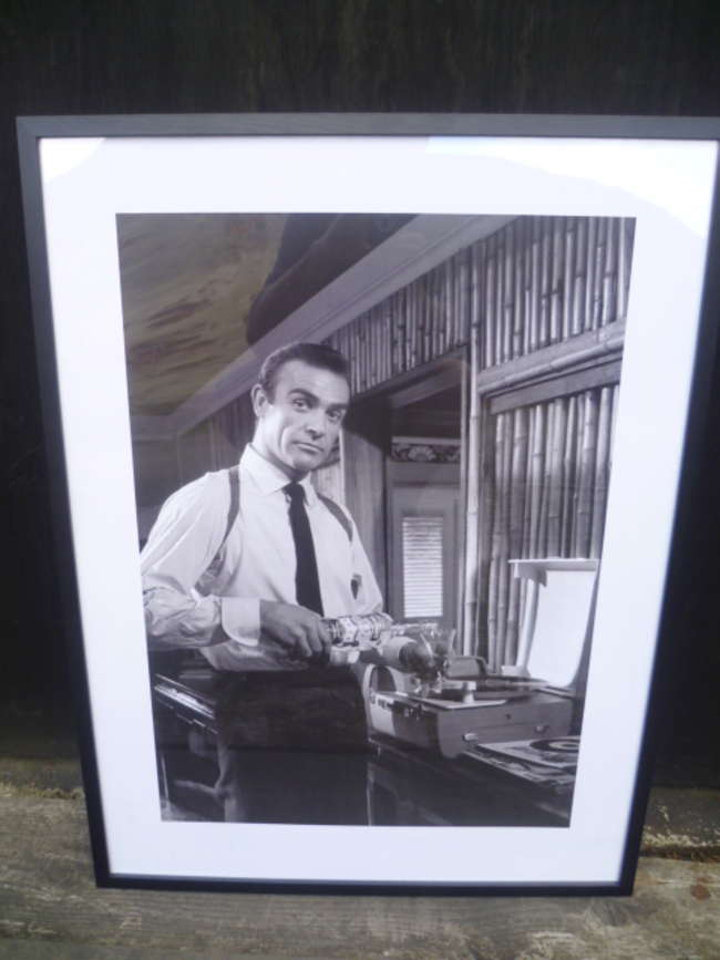 A Pair of Framed Prints depicting Sean Connery as 007 in 'Go-Sold