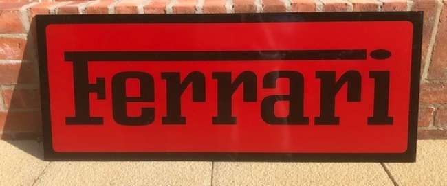 A Ferrari-themed Celluloid Garage-Type Wall Sign-Sold