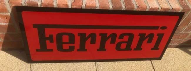 A Ferrari-themed Celluloid Garage-Type Wall Sign-Sold
