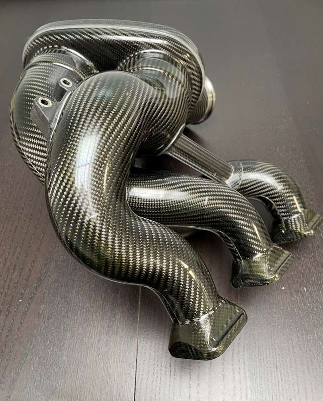 A Pair of Mercedes-AMG ONE Prototype Carbonfibre Intake Mani-Auction Lot