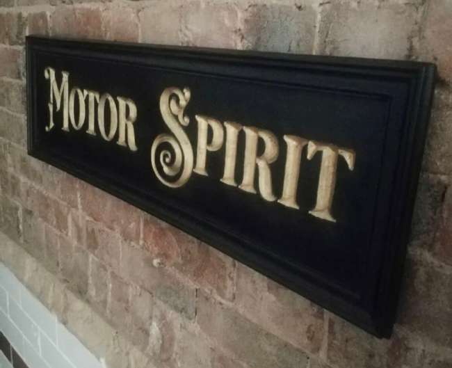 A Beautiful Hand-Carved Wooden 'Motor Spirit' Wall Sign -Sold