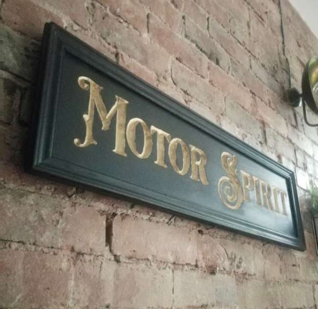 A Beautiful Hand-Carved Wooden 'Motor Spirit' Wall Sign -Sold