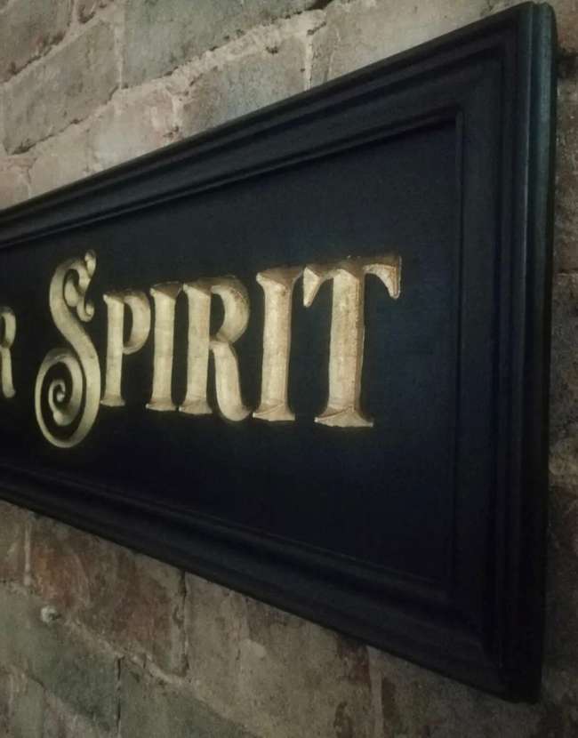 A Beautiful Hand-Carved Wooden 'Motor Spirit' Wall Sign -Sold