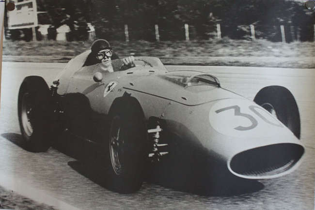 Seven Large Format Photographic Prints of Racing Ferraris Through the Years