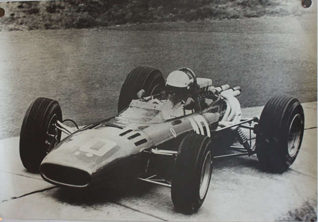 Seven Large Format Photographic Prints of Racing Ferraris Through the Years