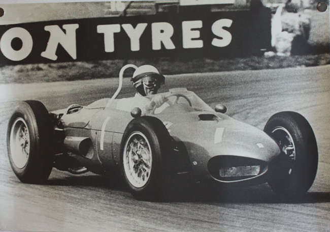 Seven Large Format Photographic Prints of Racing Ferraris Through the Years