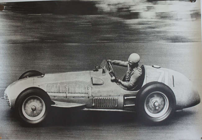 Seven Large Format Photographic Prints of Racing Ferraris Through the Years