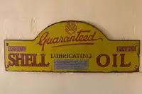 An Early 'Guaranteed Shell Lubricating Oil' Enamel Sign-Sold