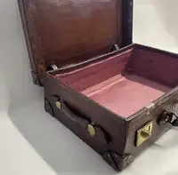 A Large Crocodile Skin Suitcase/Trunk Bearing the Initials  A.C.G.