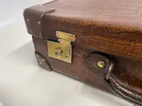 A Large Crocodile Skin Suitcase/Trunk Bearing the Initials  A.C.G.