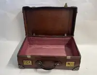 A Large Crocodile Skin Suitcase/Trunk Bearing the Initials  A.C.G.