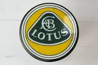 An F1 Rear Tyre Topped with a Toughened Glass Lotus Motif-Sold