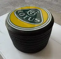 An F1 Rear Tyre Topped with a Toughened Glass Lotus Motif-Sold