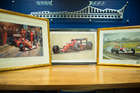 Three select framed artworks of a motoring nature-Auction Lot