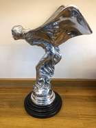 An over-sized cast metal and silvered statue of the Spirit o-Sold