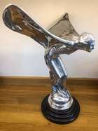 An over-sized cast metal and silvered statue of the Spirit o-Sold