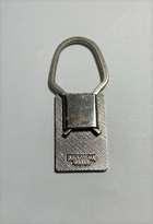 1970s Ferrari Key Ring Coloured Enamel E.F. Black Cavallino -Auction Lot