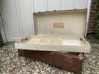 Selection of Four Well-Travelled Suitcases-Auction Lot