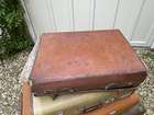 Selection of Four Well-Travelled Suitcases-Auction Lot