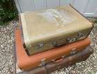Selection of Four Well-Travelled Suitcases-Auction Lot
