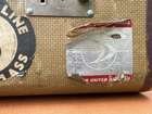Selection of Four Well-Travelled Suitcases-Auction Lot