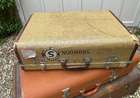 Selection of Four Well-Travelled Suitcases-Auction Lot