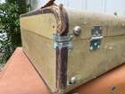 Selection of Four Well-Travelled Suitcases-Auction Lot